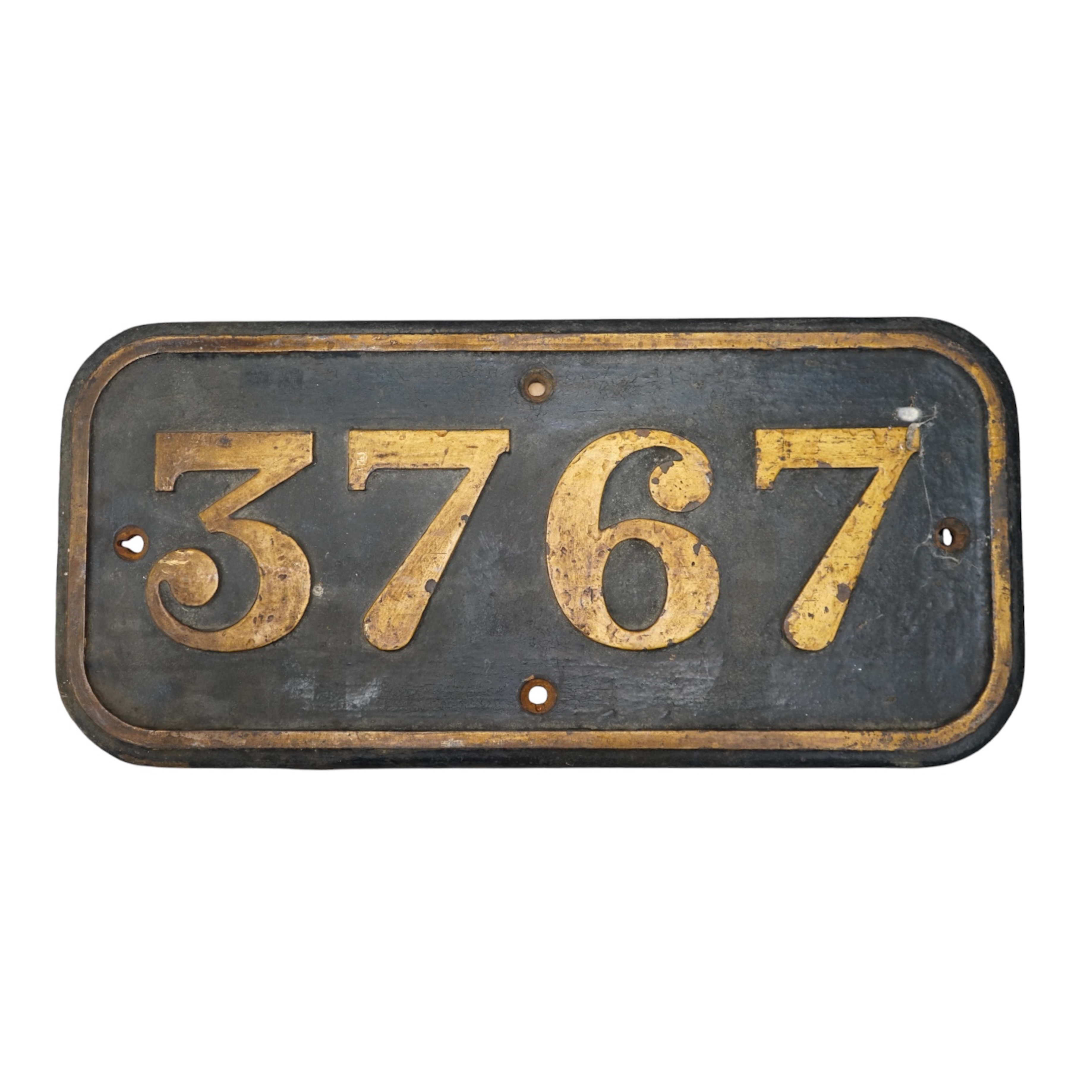 A cast iron GWR locomotive cab side number plate for a Class 57xx 0-6-0PT locomotive, 3767, built in 1937/38 at the Swindon Works, dimensions; 65cm x 30.5cm. Condition - fair to good, generally ex-loco condition with som